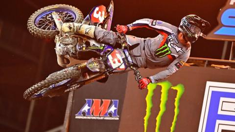 Eli Tomac throwing a tail whip on his monster energy star racing yamaha yz 450f over the finish line after winning a supercross race