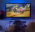 pov person watching tv. hand holding remote blurry at bottom. main image of a tv with motocross racing on screen. 