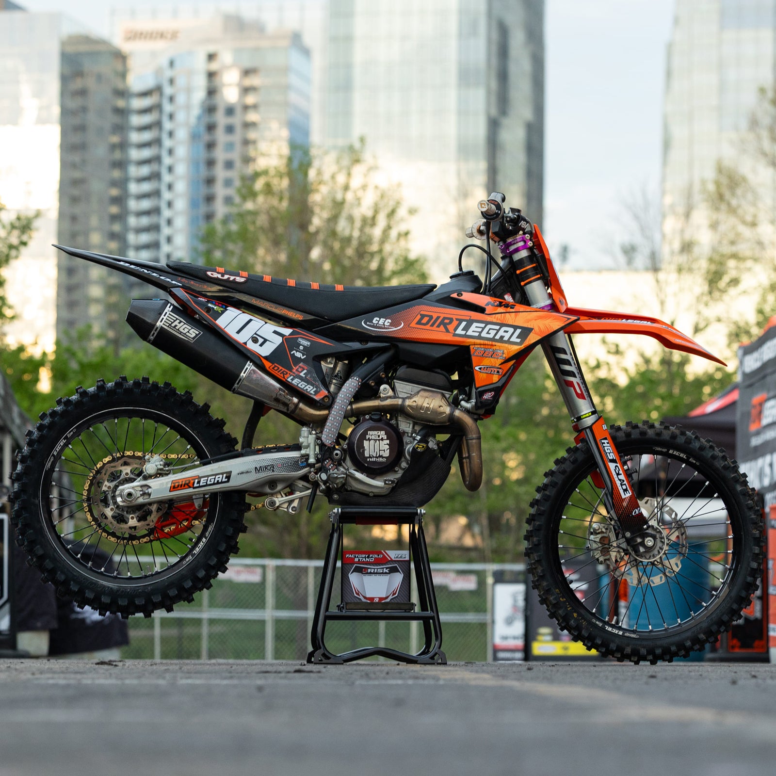Black metal MX stand with 'Rick Racing' branding on a white background