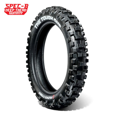 Off-road motorcycle tire with deep tread and 'The Tough One' branding.