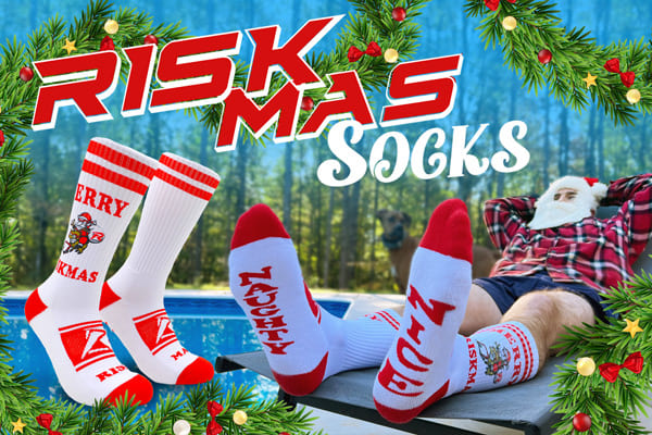 Riskmas socks banner featuring Ethan posing poolside wearing a Santa hat and beard.