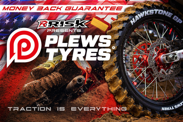 Plews Tyres motocross and enduro tires home page banner. text: money back guarantee. Risk presents Plews Tyres. Traction is everything. Background image of MX racer in a hard turn leaning. Hawkstone tire trowing dirt. American Flag fading out in the upper left.