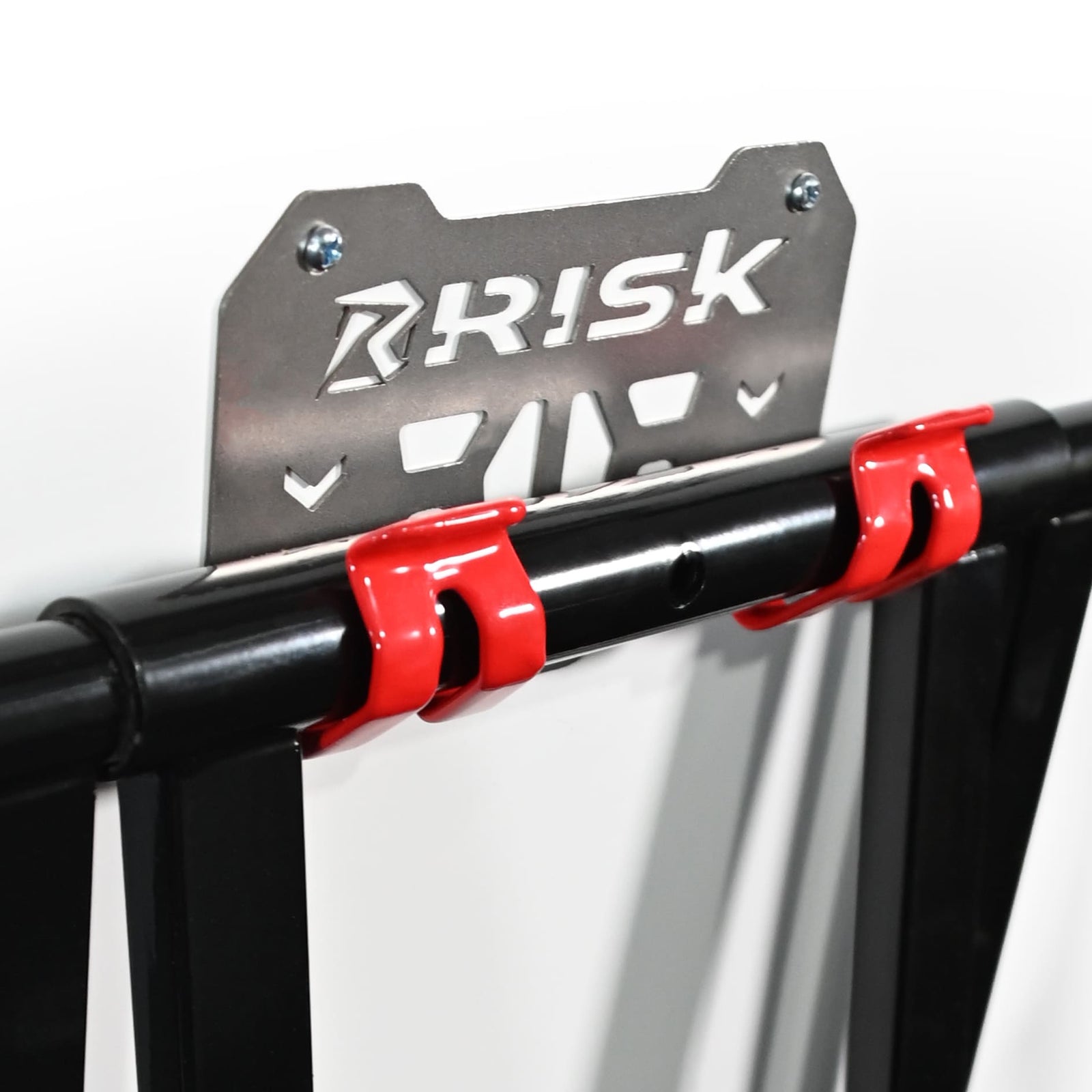 Two red and gray metal RR1 wall mounts with 'RISK' branding on a white background