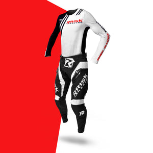 Risk Racing Motocross Jersey White Black shown with a pair of VENTilate PRO pants on a red and white background
